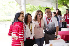 A happy group of IU alumni volunteers poses together at an alumni event.